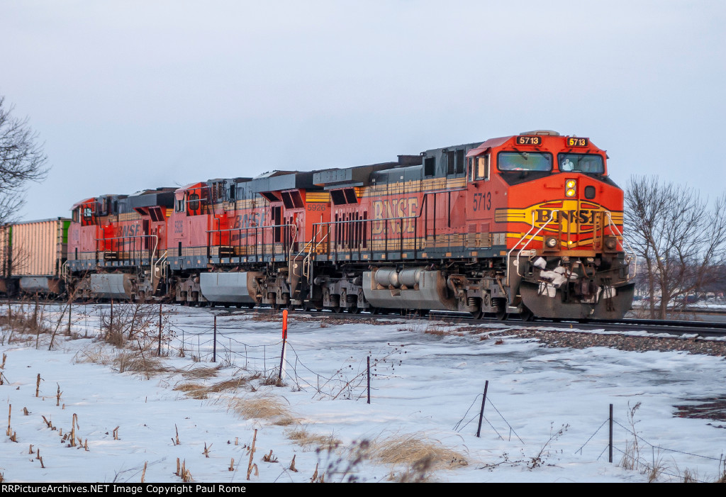 BNSF 5713 GE AC44CW and BNSF 5926 GE ES44AC and sister unit work a westbound empty hopper train